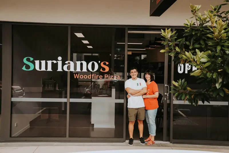Giorgio and Gianna outside Suriano’s on Courage Street